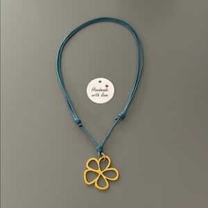 Gold Clover Pendant on Blue Cord Necklace